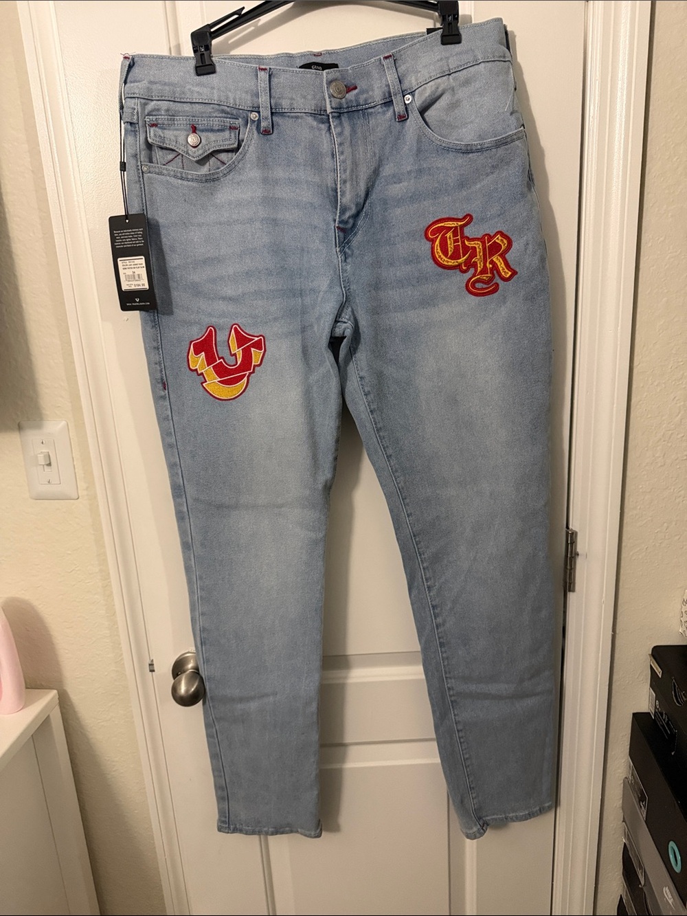 True Religion Light Blue Jeans with Red & Yellow Patch Accents